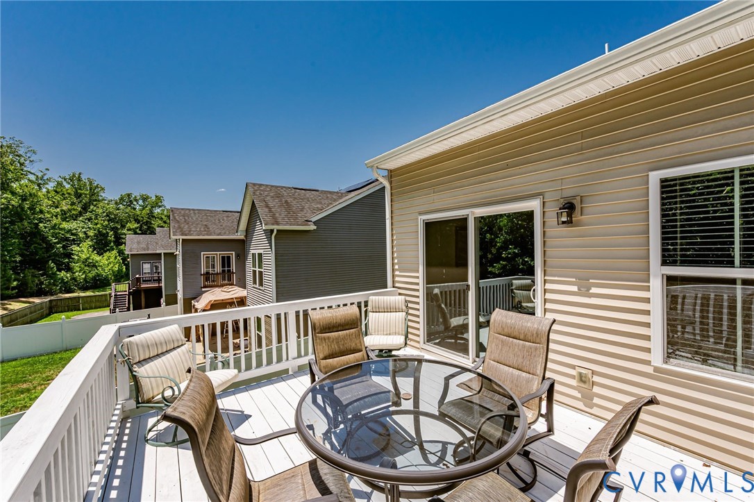 7435 Wicks Road Williamsburg, VA 23188 - Photo 39 of 82 Spacious exterior deck featuring white railing and