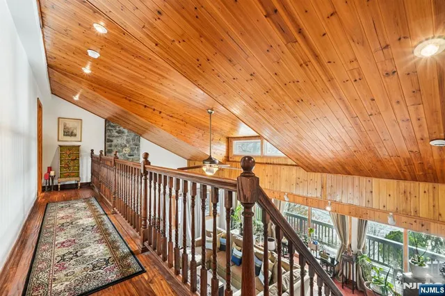 a view of balcony with wooden floor