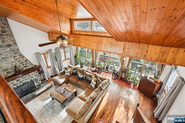 a view of balcony with wooden floor and outdoor seating