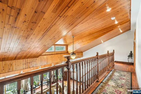a view of balcony with wooden floor