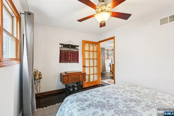 a bedroom with furniture and a window