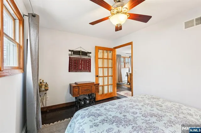 a bedroom with furniture and a window