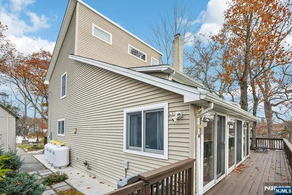 a view of a patio with a table and chairs and wooden floor