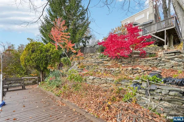 a view of a garden with a house