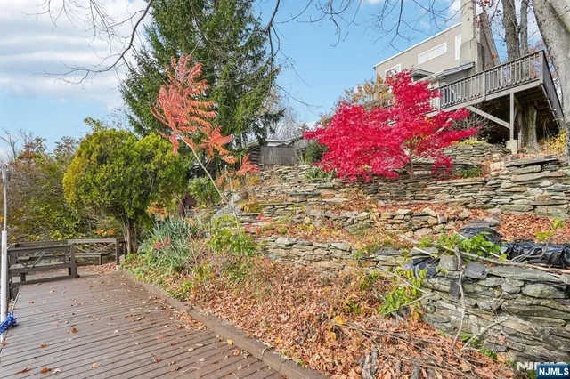 a view of a garden with a house