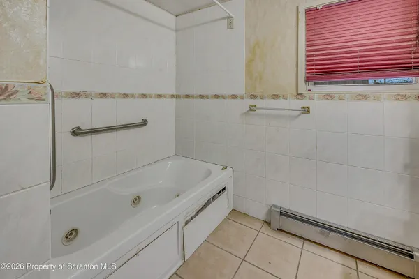 a bathroom with a sink a vanity and a mirror