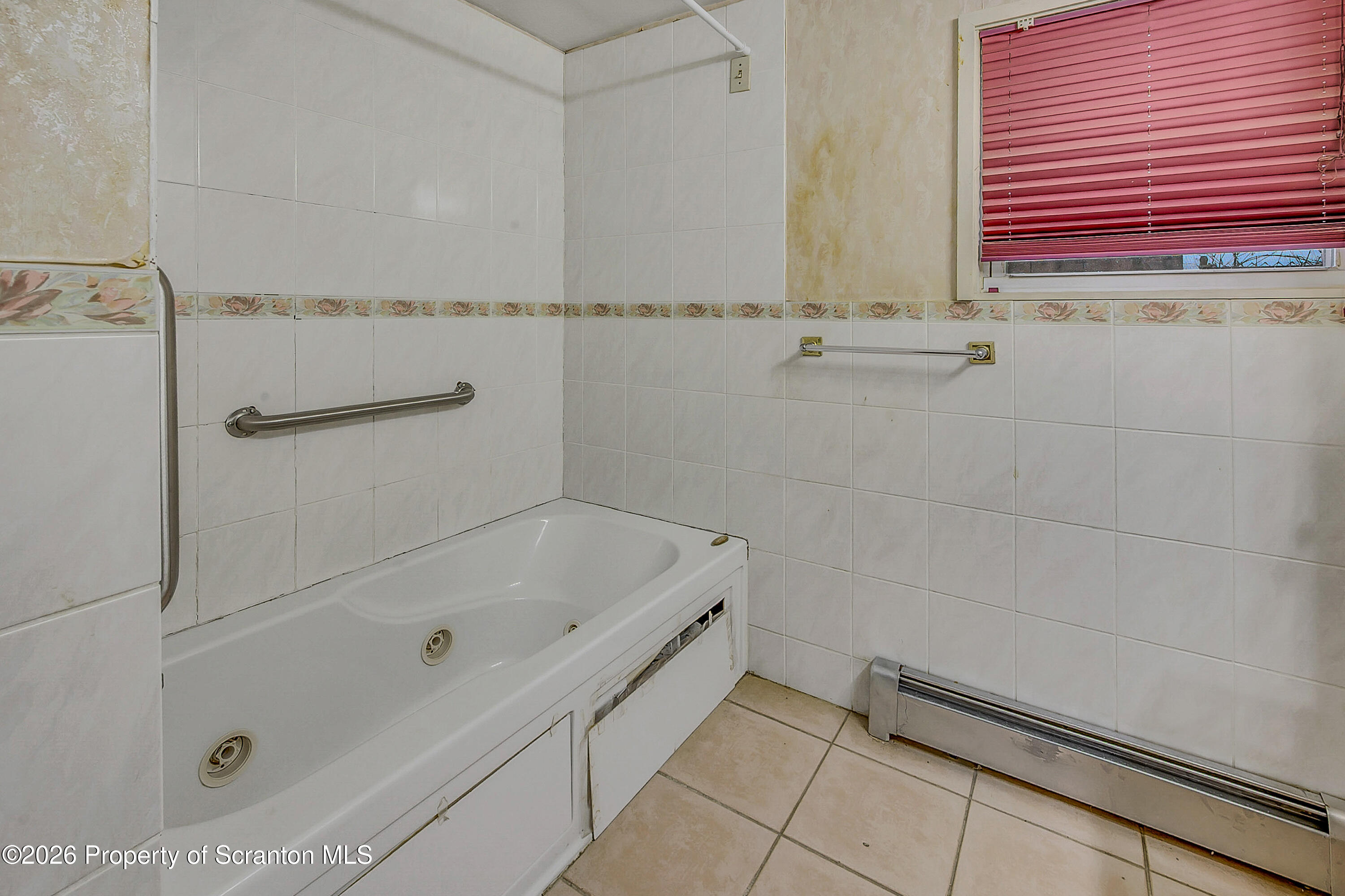 1050 Mark Avenue Dunmore, PA 18510 - Photo 15 of 35 a bathroom with a tub and a shower