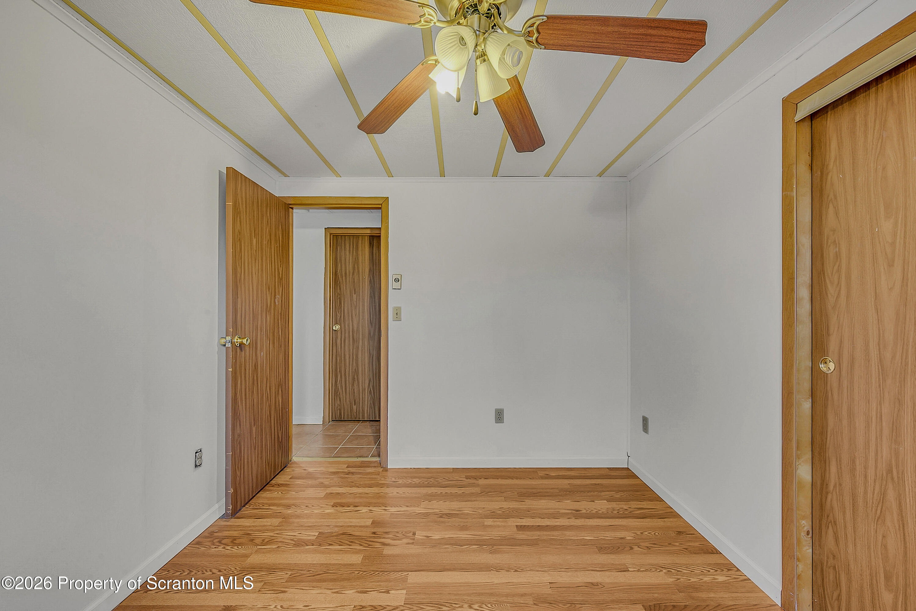 1050 Mark Avenue Dunmore, PA 18510 - Photo 27 of 35 a view of a hallway with a chandelier fan