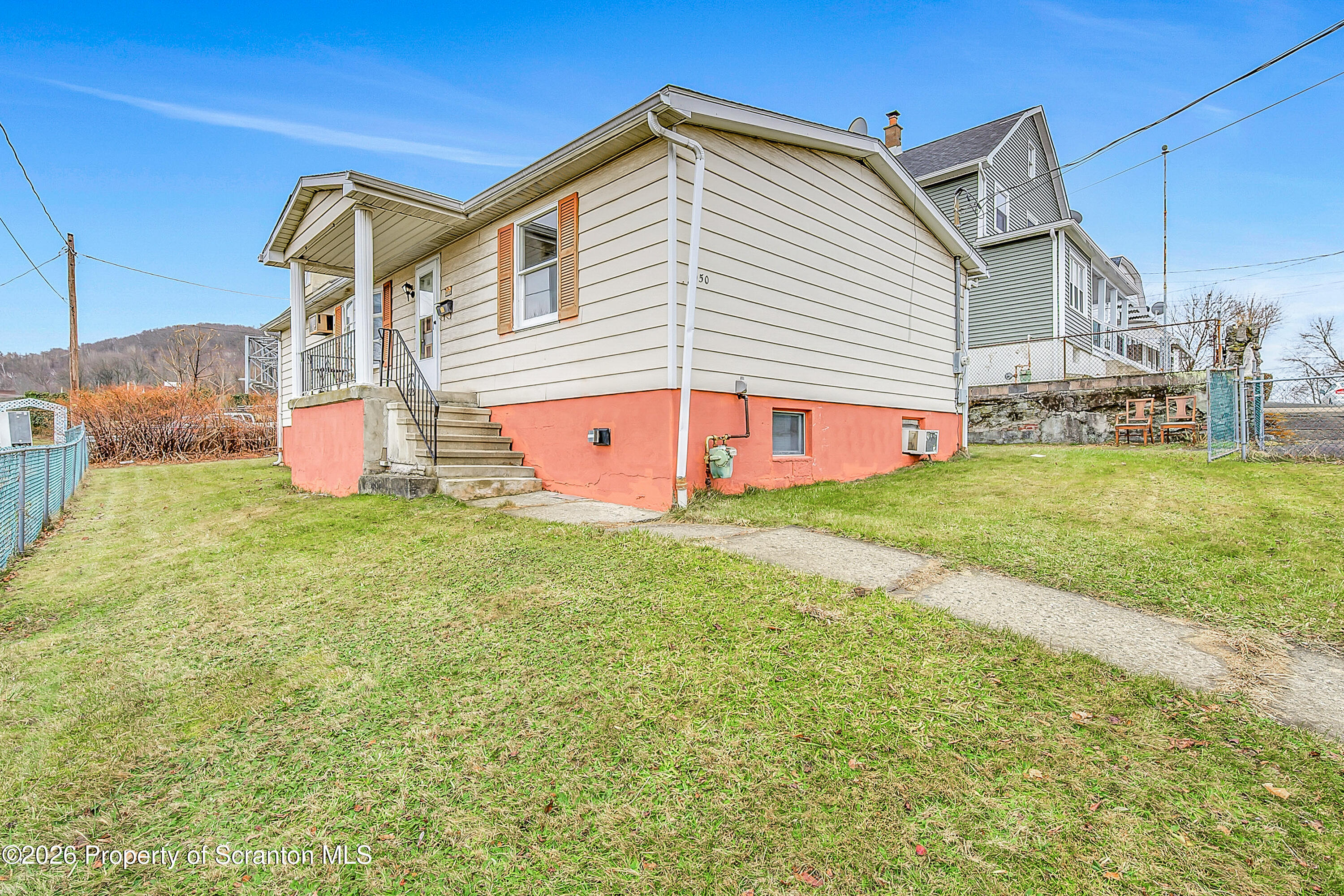 1050 Mark Avenue Dunmore, PA 18510 - Photo 5 of 35 a front view of a house with swimming pool