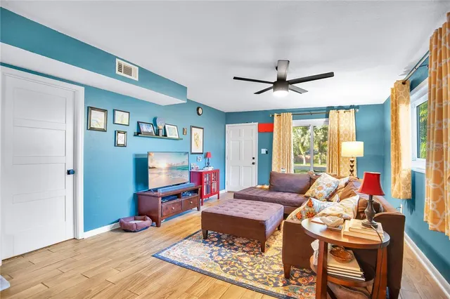 a bed room with a bed and a chandelier