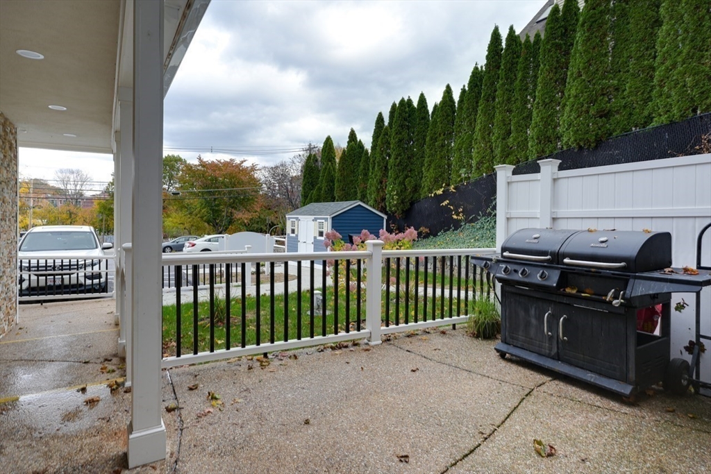 17 School Street, Unit A Hudson, MA 01749 - Photo 20 of 23 a view of a porch with a yard