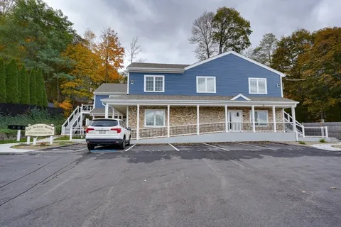 a sign on a pole on a street