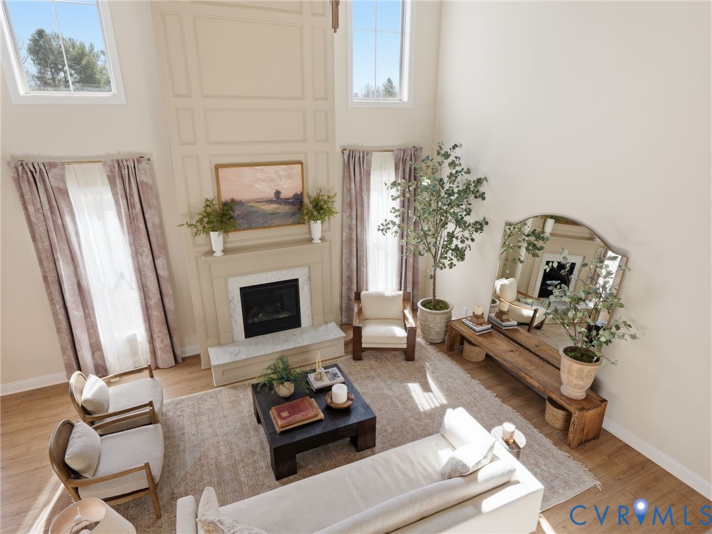 2586 Maidens Road Powhatan, VA 23139 - Photo 11 of 27 a living room with furniture and a fireplace