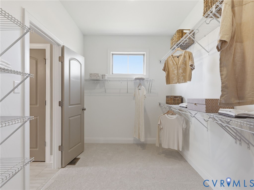 2586 Maidens Road Powhatan, VA 23139 - Photo 13 of 27 a bathroom with a sink a mirror and a shower