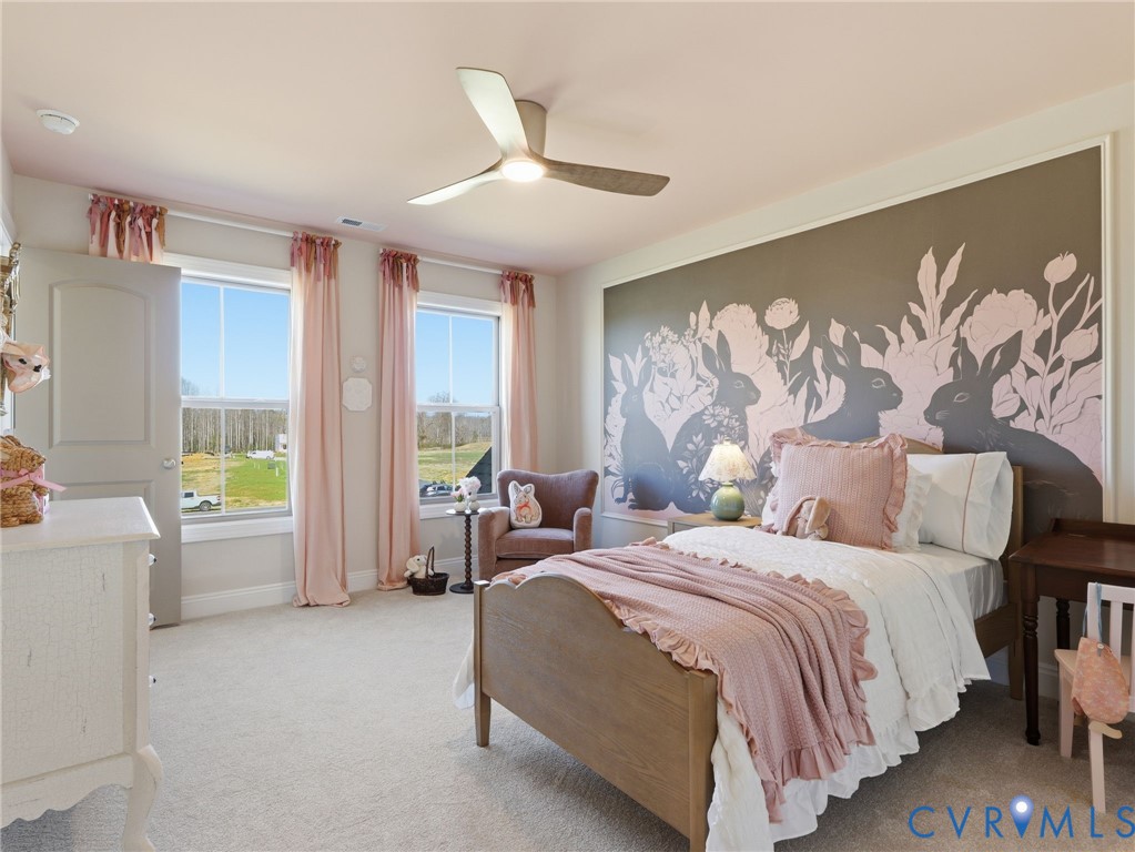 2586 Maidens Road Powhatan, VA 23139 - Photo 17 of 27 a spacious bedroom with a bed and a couch
