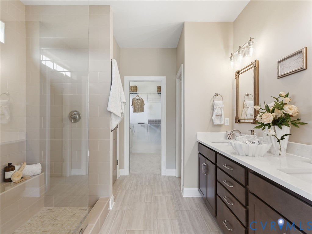 2586 Maidens Road Powhatan, VA 23139 - Photo 4 of 27 a bathroom with a sink a mirror and a shower