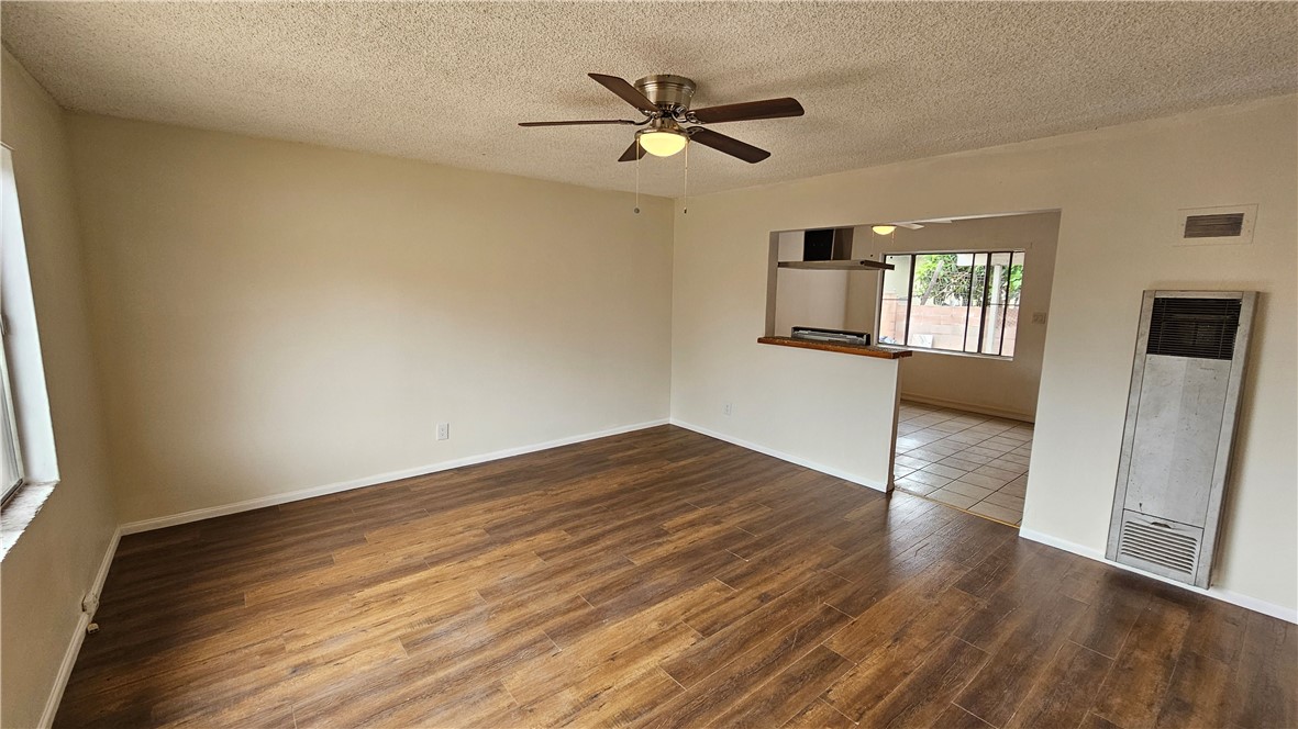 537 Ferris Street Los Angeles, CA 90022 - Photo 2 of 16 an empty room with wooden floor and windows
