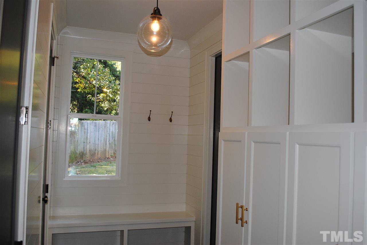 110 Revival Way Raleigh, NC 27608 - Photo 11 of 25 a bathroom with a window and a shower