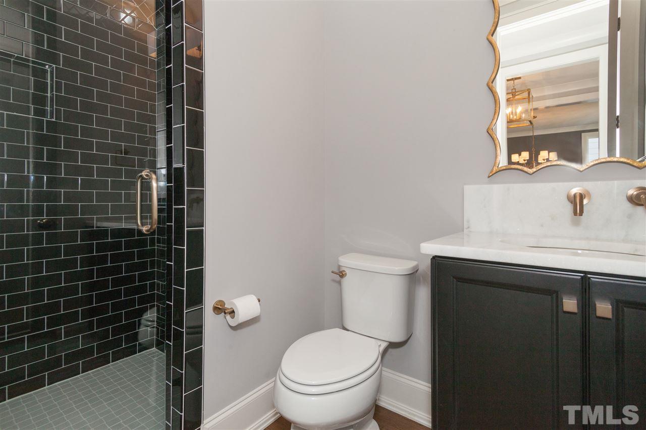 110 Revival Way Raleigh, NC 27608 - Photo 13 of 25 a bathroom with a sink toilet and shower