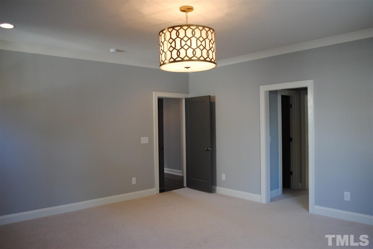 110 Revival Way Raleigh, NC 27608 - Photo 15 of 25 an empty room that has a window and a chandelier