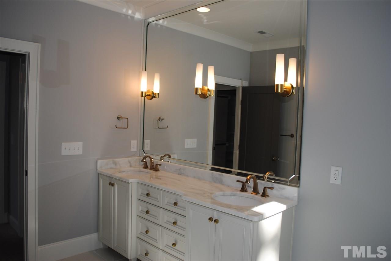 110 Revival Way Raleigh, NC 27608 - Photo 17 of 25 a bathroom with a double vanity sink and mirror