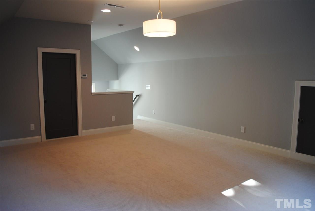 110 Revival Way Raleigh, NC 27608 - Photo 20 of 25 an empty room with a ceiling fan and window