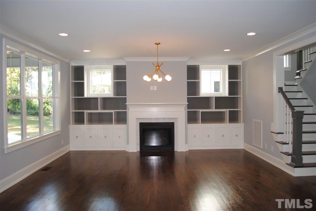 110 Revival Way Raleigh, NC 27608 - Photo 6 of 25 a living room with furniture and a fireplace