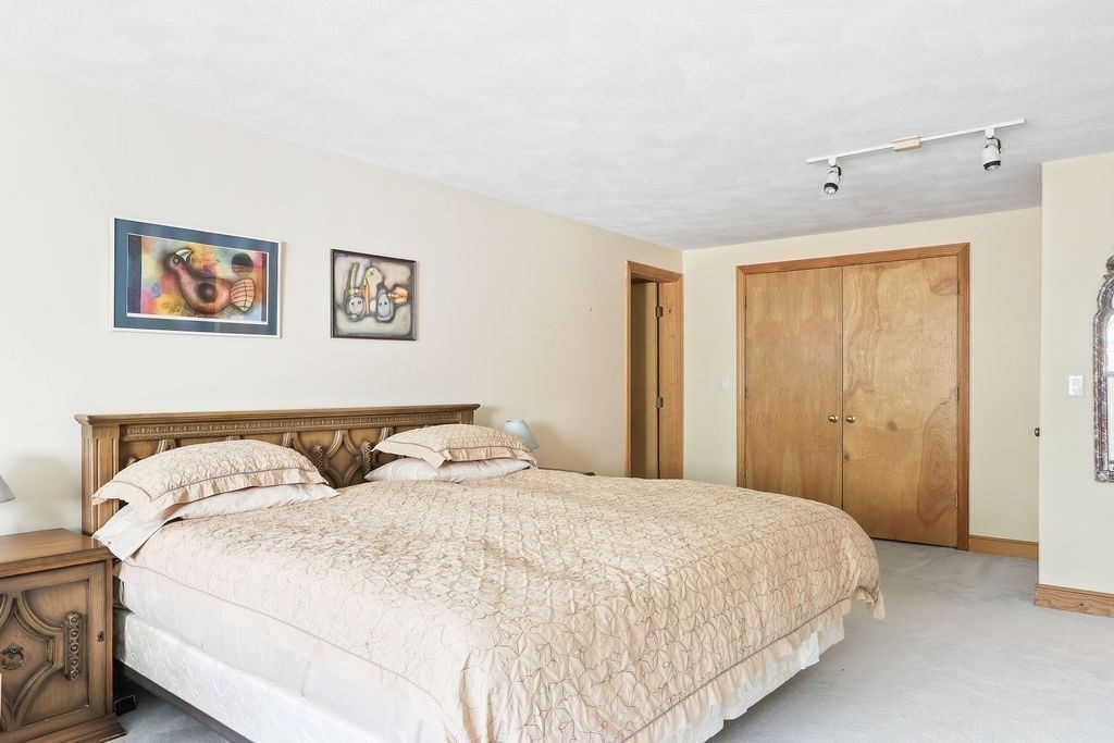 4 Woods End Needham, MA 02492 - Photo 25 of 31 a bedroom with a bed and a window