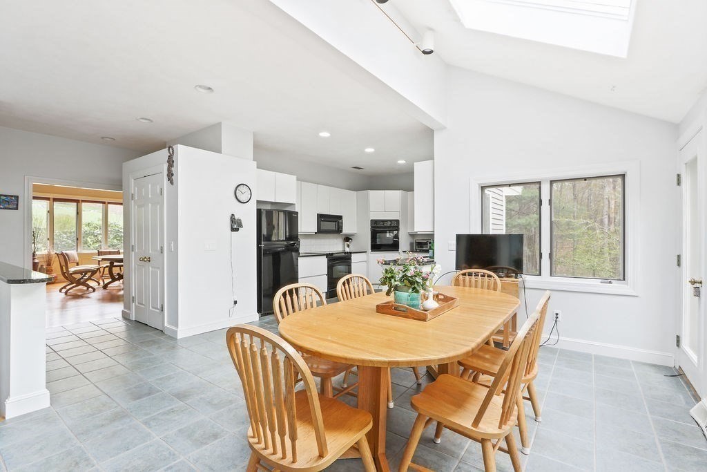 4 Woods End Needham, MA 02492 - Photo 10 of 31 a view of a dining room with furniture and a potted plant