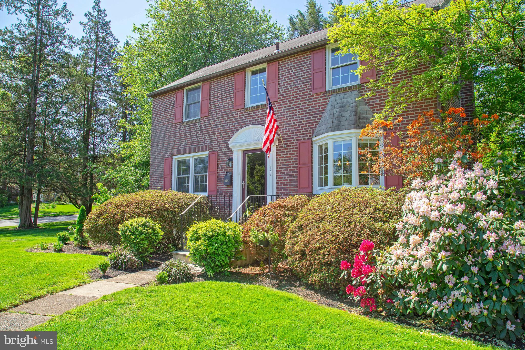 584 Valley View Road Springfield, PA 19064 - Photo 2 of 38 a front view of a house with a yard and potted plants