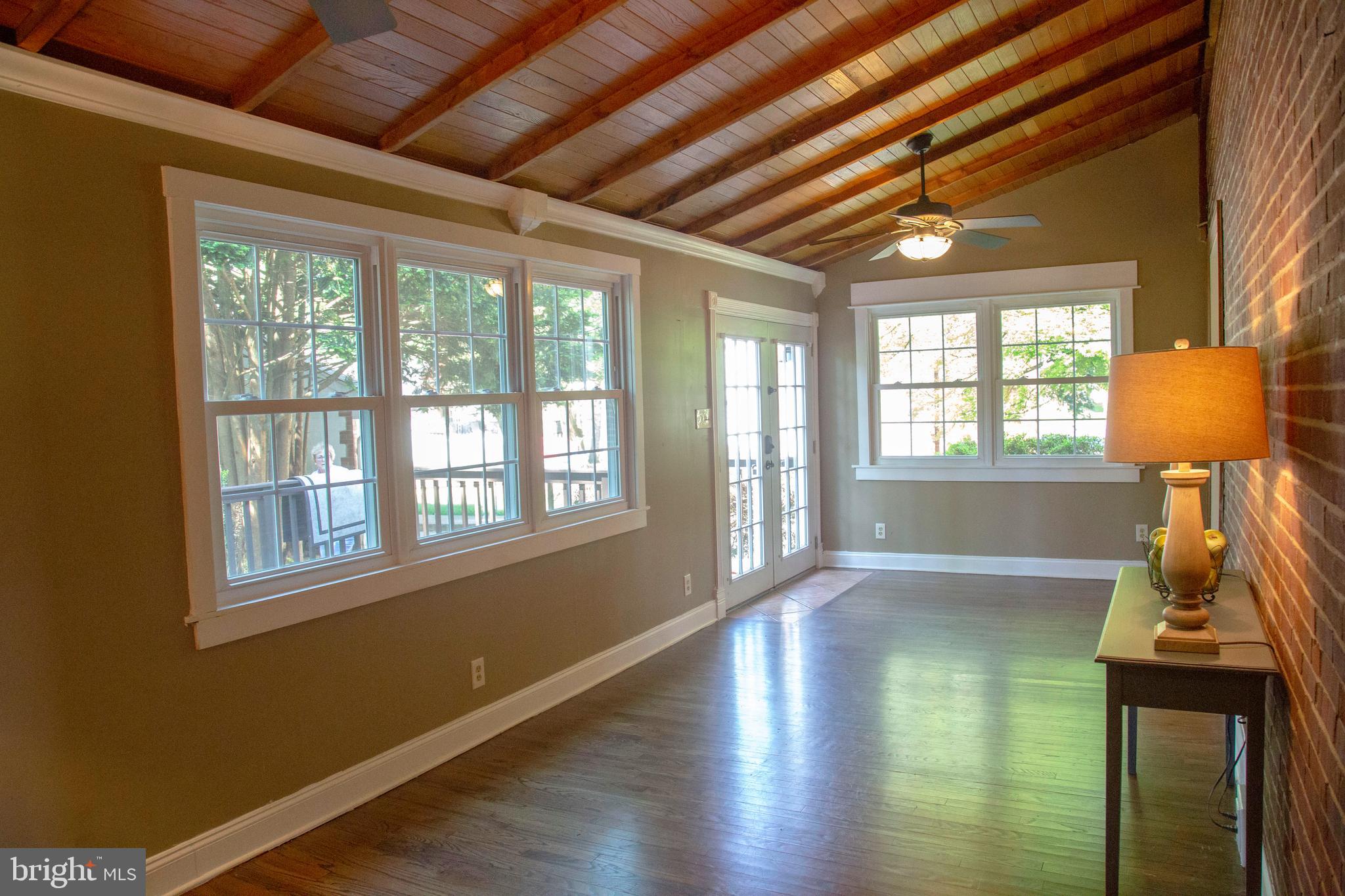 584 Valley View Road Springfield, PA 19064 - Photo 12 of 38 a view of a livingroom with wooden floor and a ceiling fan