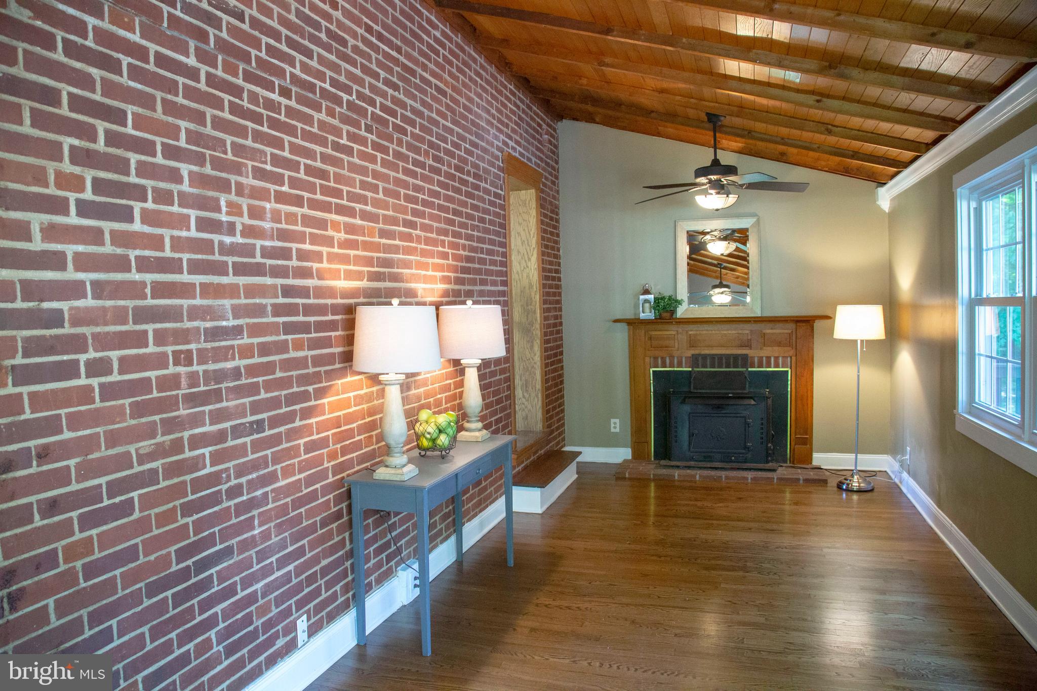 584 Valley View Road Springfield, PA 19064 - Photo 13 of 38 a view of a livingroom with a fireplace and window