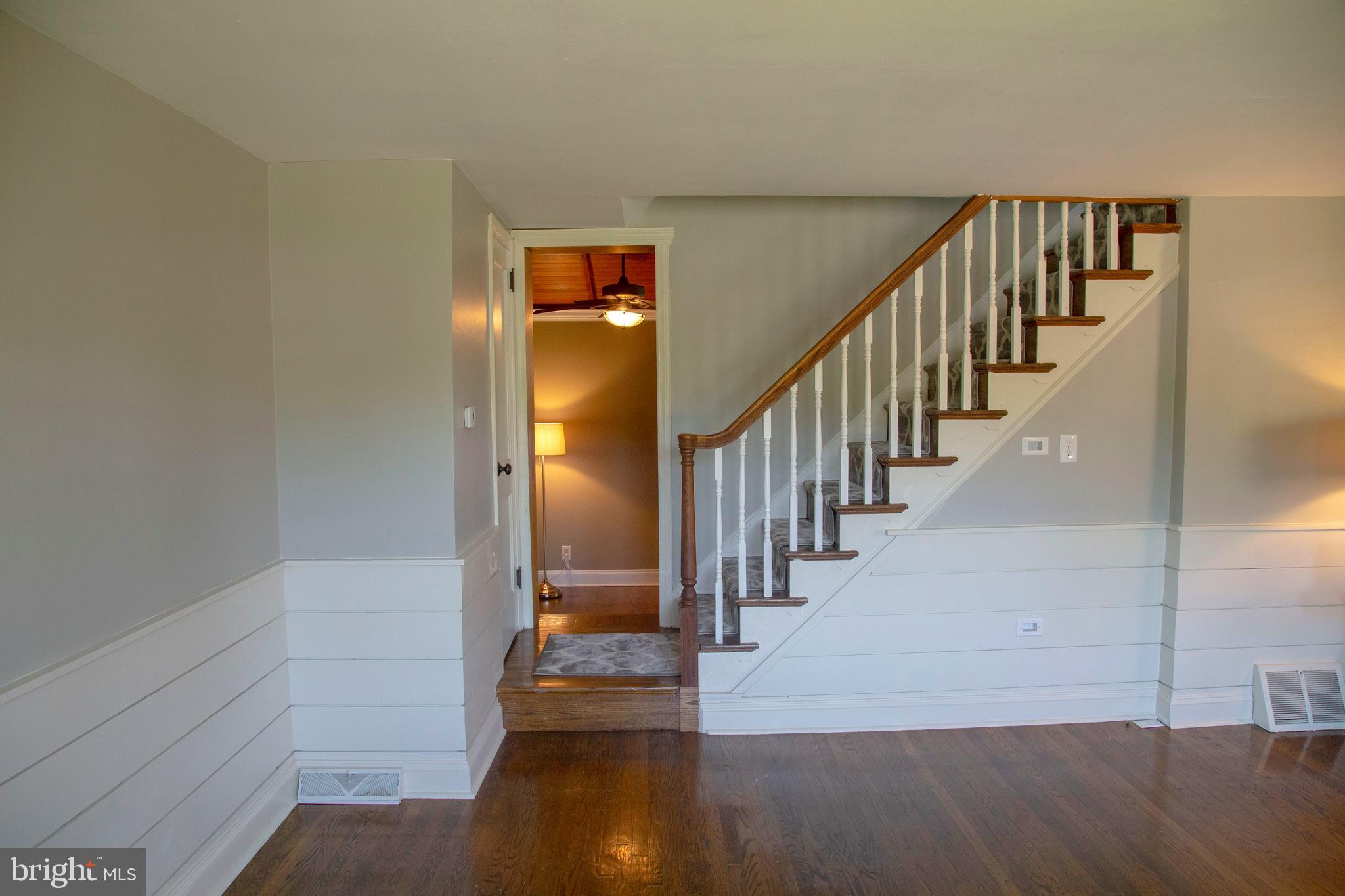 584 Valley View Road Springfield, PA 19064 - Photo 17 of 38 a view of a hallway with wooden floor and entryway