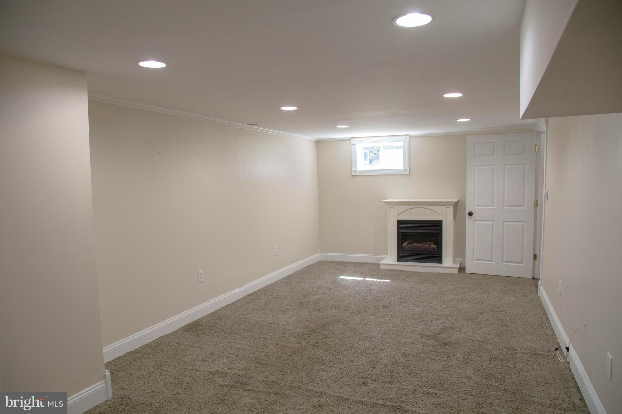 584 Valley View Road Springfield, PA 19064 - Photo 27 of 38 a view of an empty room with a fireplace