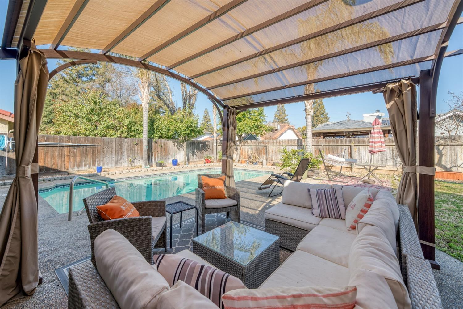 2505 Stuart Avenue Clovis, CA 93611 - Photo 15 of 23 a living room with furniture and a floor to ceiling window