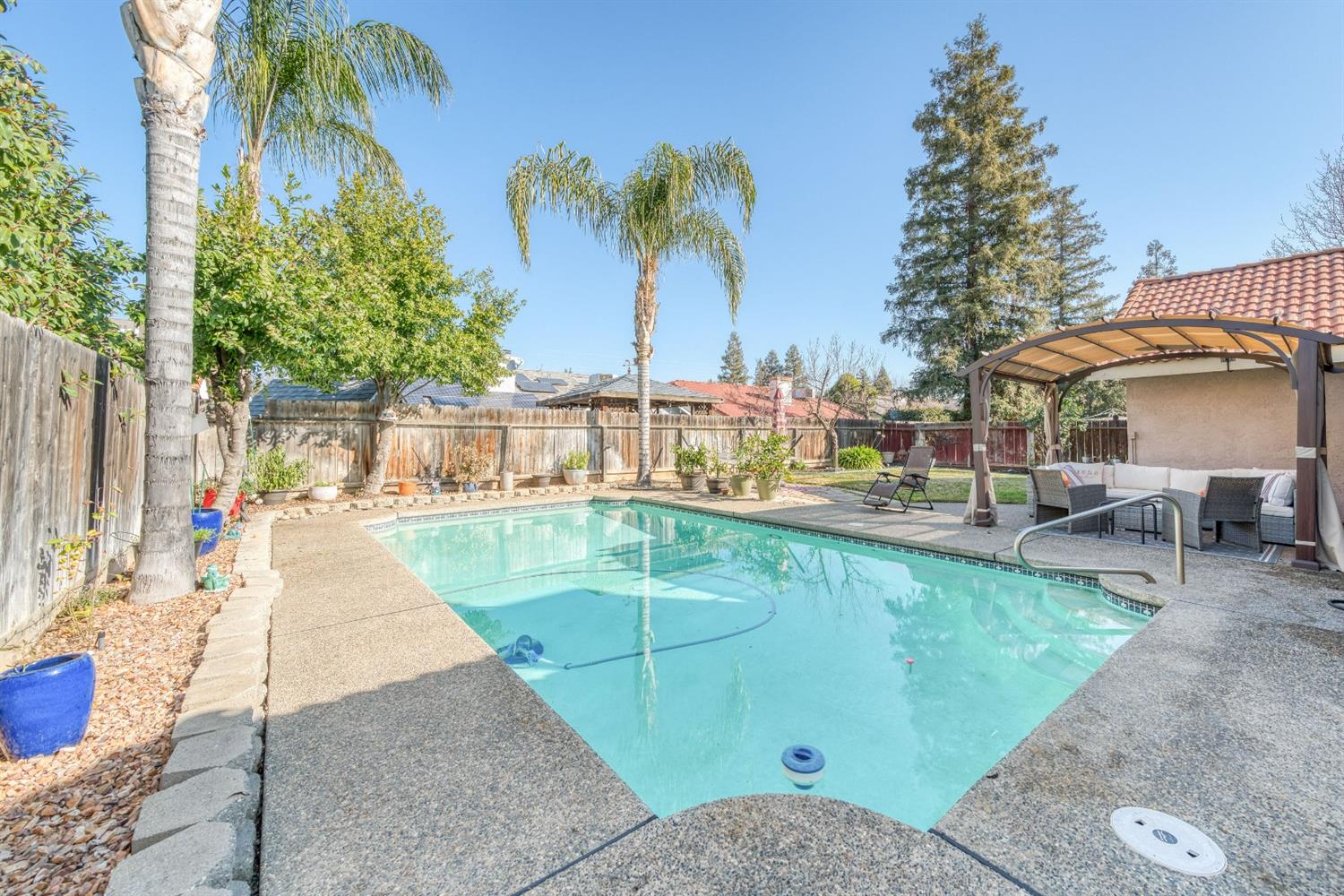2505 Stuart Avenue Clovis, CA 93611 - Photo 17 of 23 a view of a swimming pool with a patio