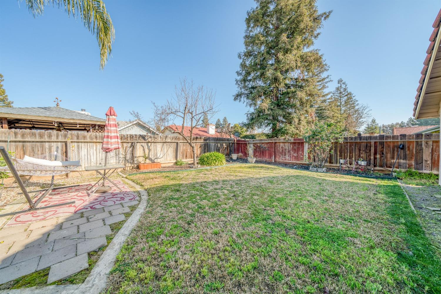 2505 Stuart Avenue Clovis, CA 93611 - Photo 18 of 23 a view of a house with backyard and sitting area