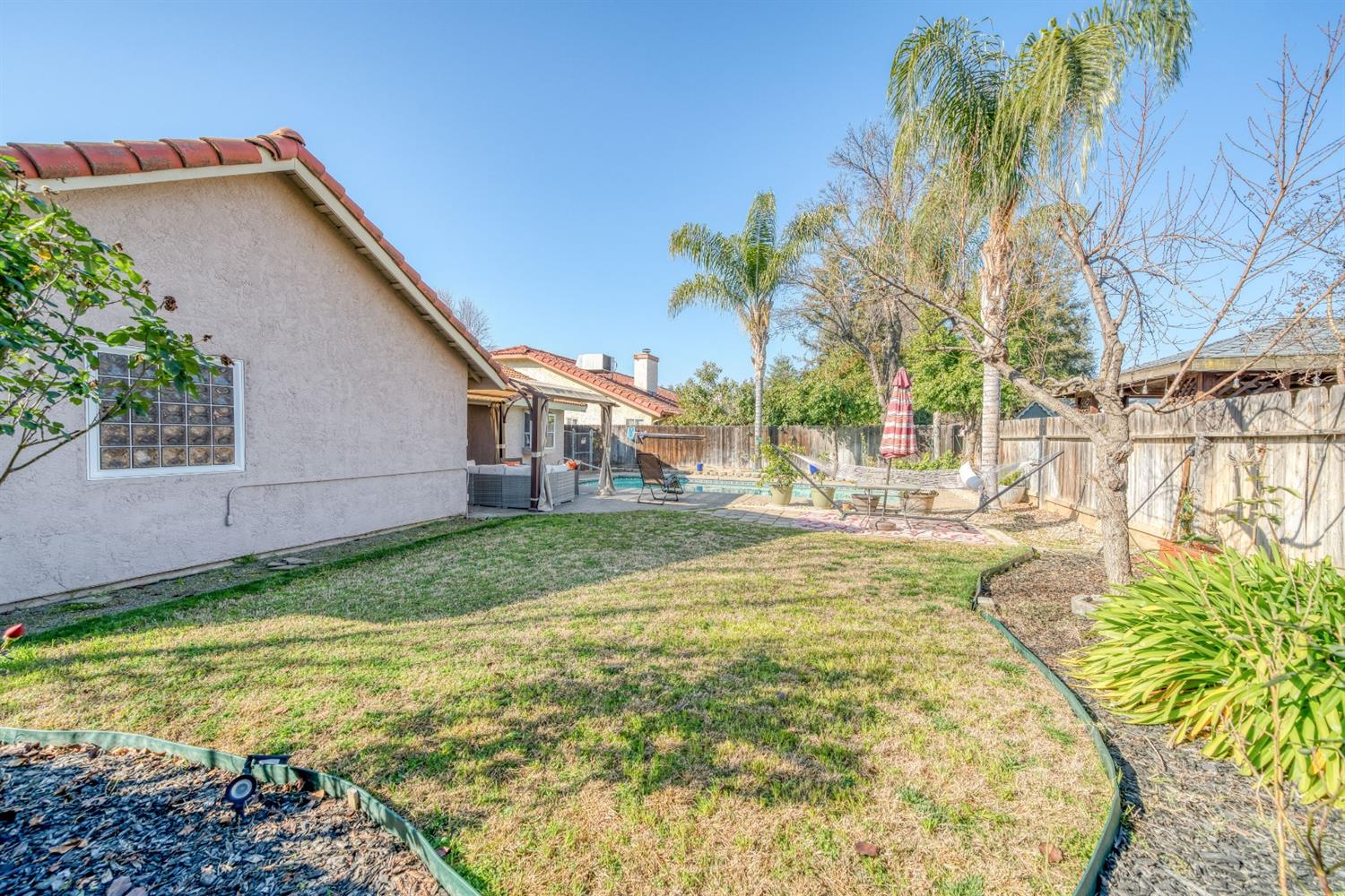 2505 Stuart Avenue Clovis, CA 93611 - Photo 20 of 23 a view of swimming pool with a yard