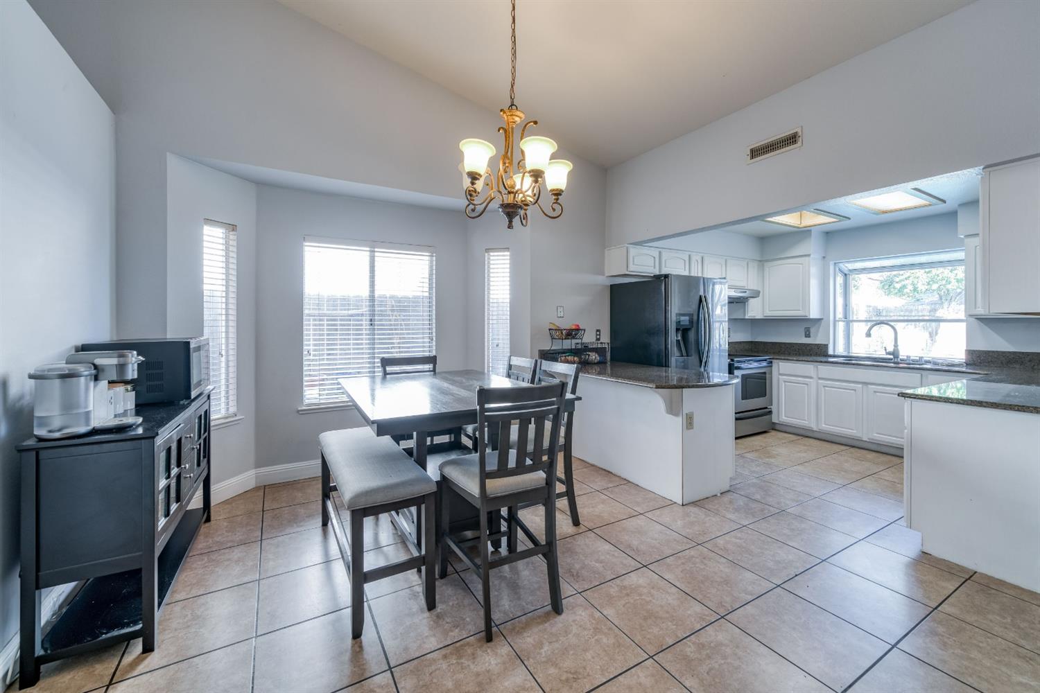 2505 Stuart Avenue Clovis, CA 93611 - Photo 4 of 23 a view of a dining room kitchen and a window
