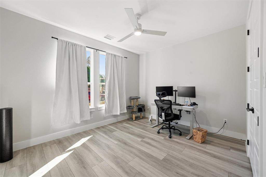 7733 Indian Ridge Trail Dallas, TX 75232 - Photo 18 of 30 a view of a workspace with furniture and a window