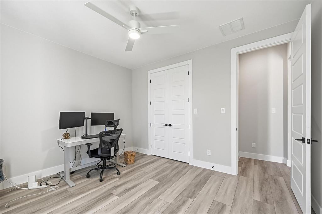 7733 Indian Ridge Trail Dallas, TX 75232 - Photo 20 of 30 a view of a workspace with furniture and a window