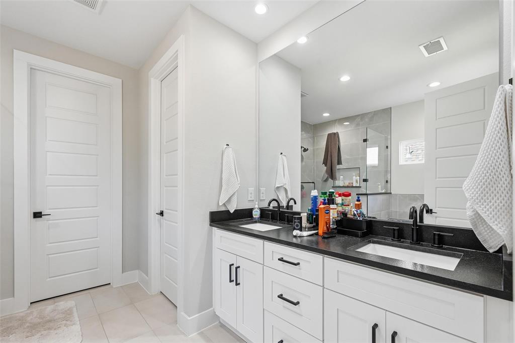 7733 Indian Ridge Trail Dallas, TX 75232 - Photo 9 of 30 a kitchen with cabinets and window
