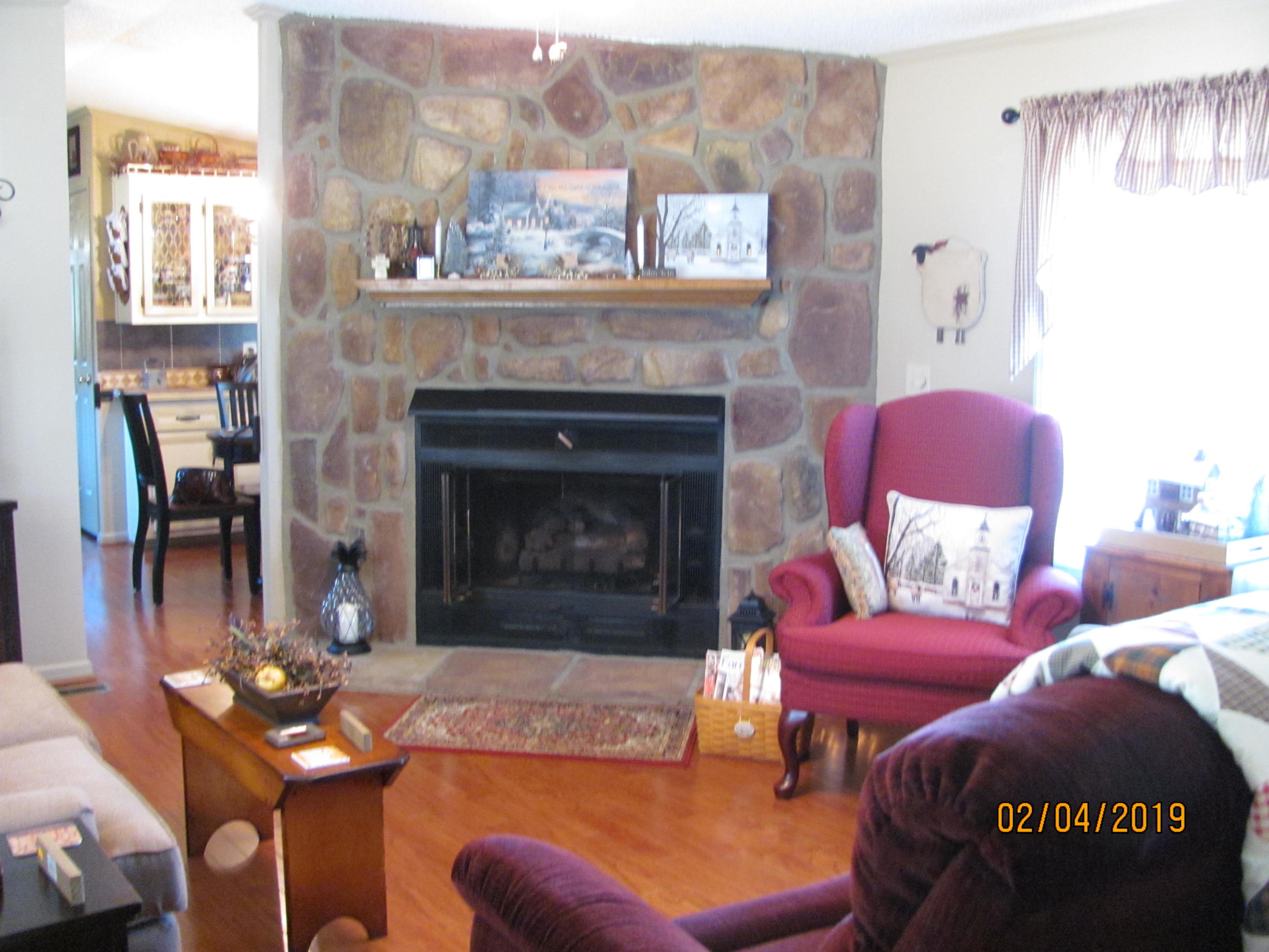 4121 Pike Road Montvale, VA 24122 - Photo 4 of 26 Living Room-gas log fireplace & hardwoo