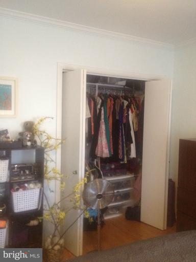 2012 O Street Northwest, Unit 42 Washington, DC 20036 - Photo 11 of 22 a view of walk in closet with clothes and shoes
