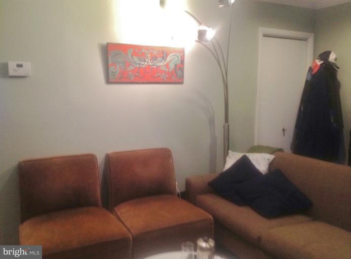 2012 O Street Northwest, Unit 42 Washington, DC 20036 - Photo 15 of 22 a living room with furniture and a mirror