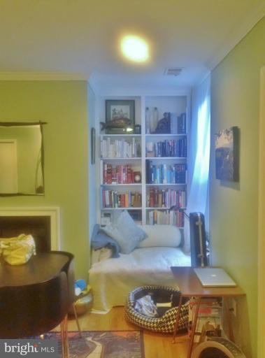 2012 O Street Northwest, Unit 42 Washington, DC 20036 - Photo 21 of 22 a living room with stainless steel appliances furniture and a fireplace