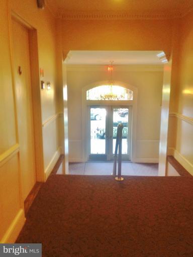 2012 O Street Northwest, Unit 42 Washington, DC 20036 - Photo 7 of 22 a view of a hallway with wooden floor and a cabinet