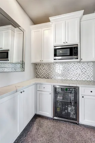 a kitchen with stainless steel appliances a stove microwave and cabinets