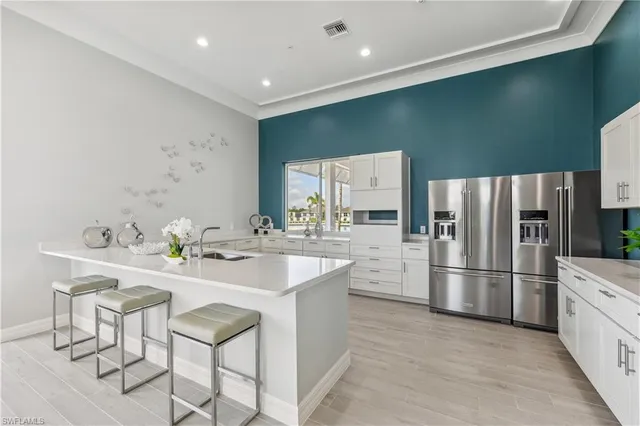 a kitchen with refrigerator and furniture