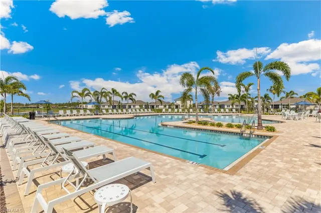 a view of swimming pool with outdoor seating